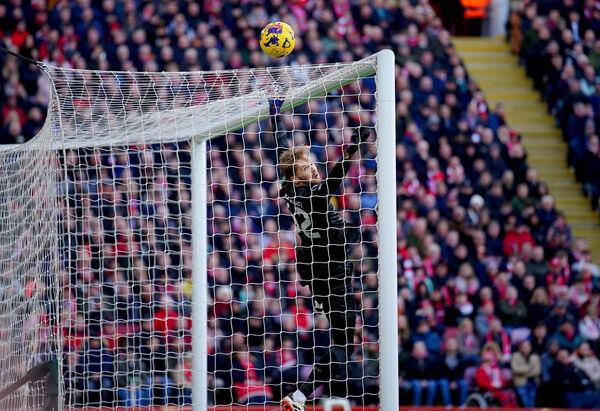 The ball hits the cross bar as Liverpool goalkeeper Caoimhin Kelleher jumps to make a save. Photo credit: Peter Byrne/PA Wire.